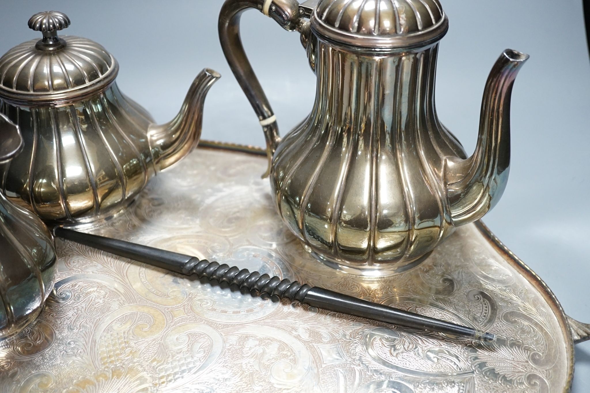 A four piece plated tea set and tray